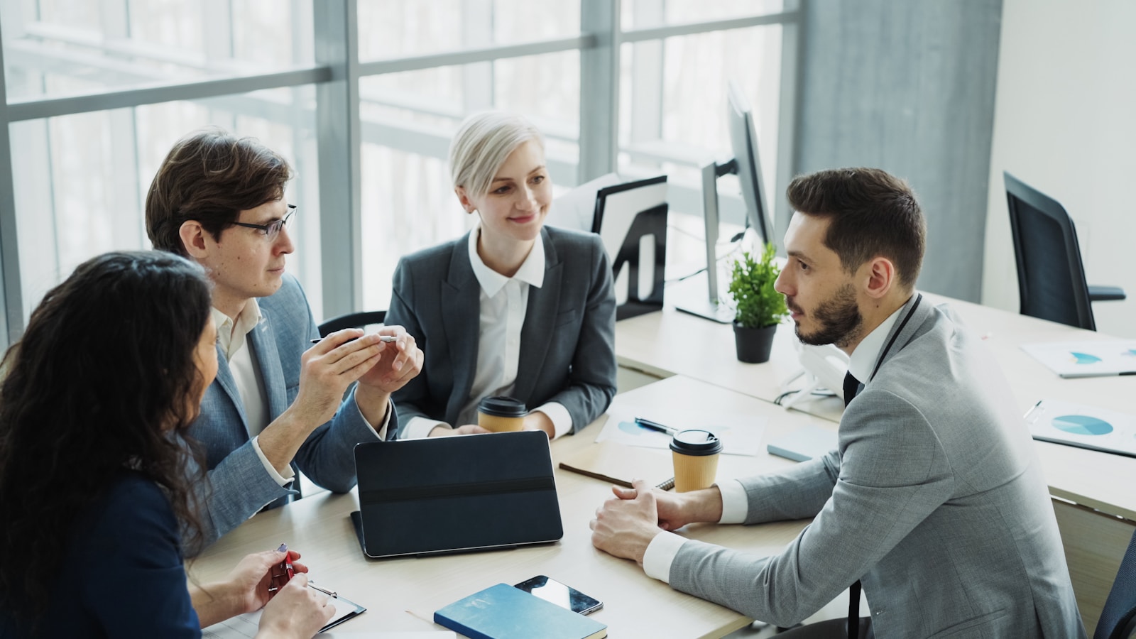 Business team collaborating around a table in a modern office